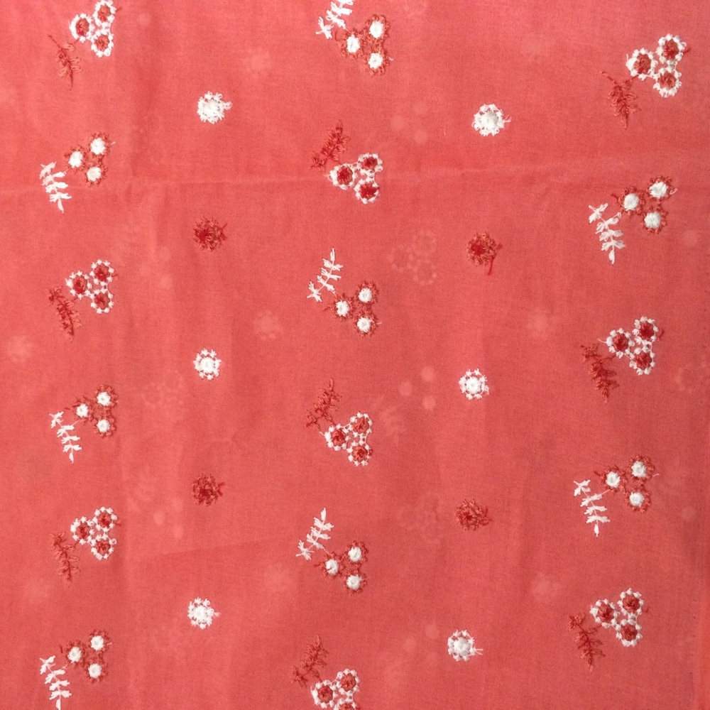Salmon color embroidered fabric